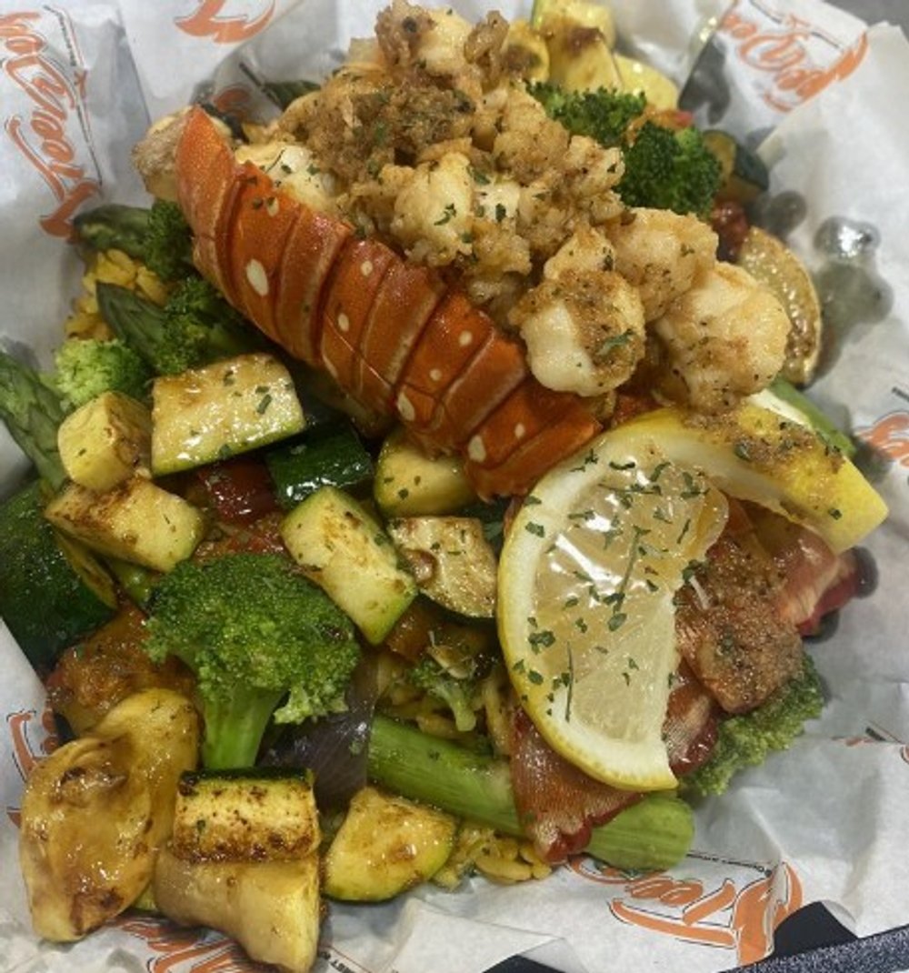 Veggie Ricebowl topped with a sauté Lobsters Bite at Teedeez in Maple Heights, OH.