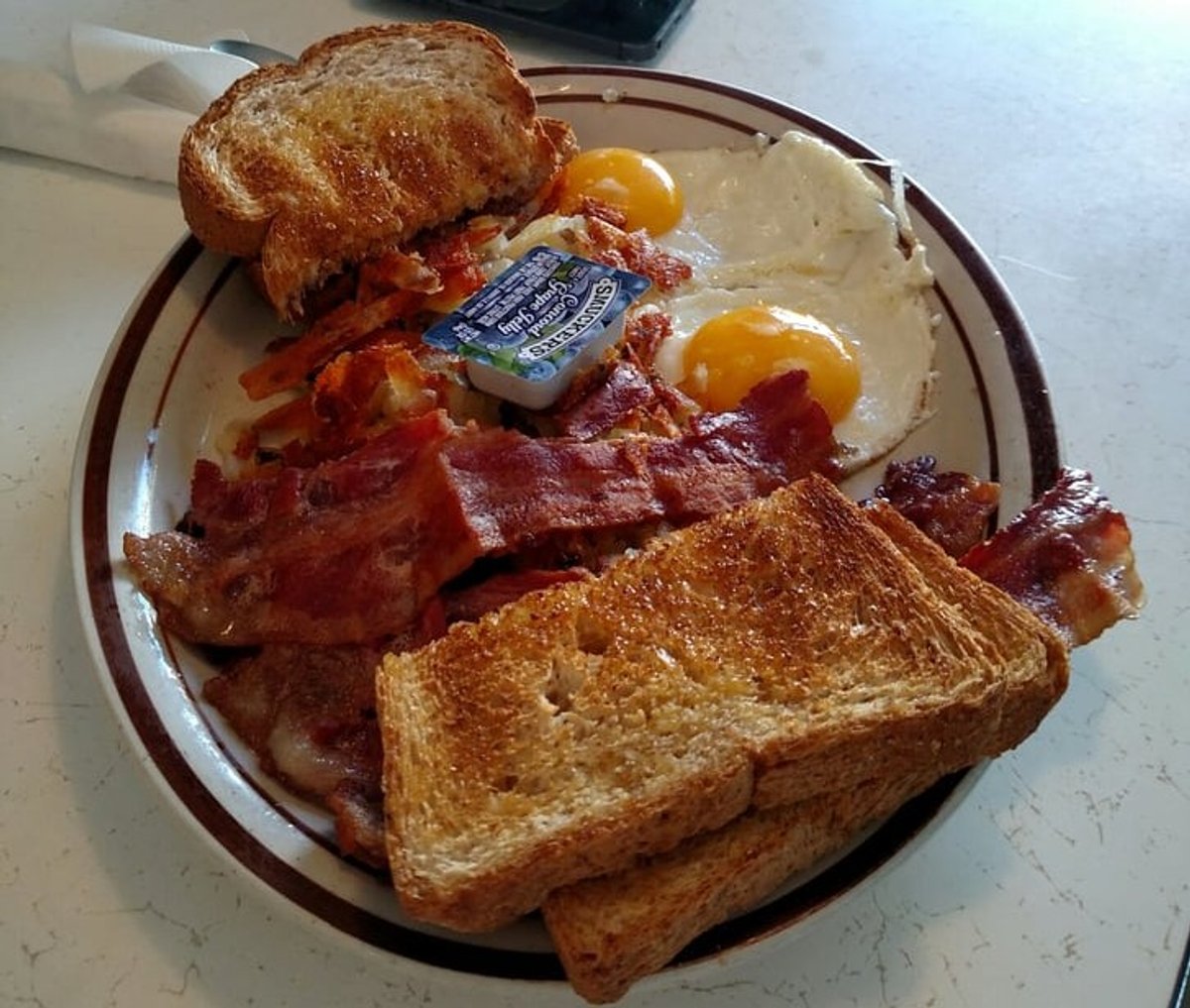 Eggs, hashbrowns and bacon in Our Kitchen in Minneapolis, MN.