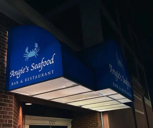 Exterior signage of Angie's Seafood at night