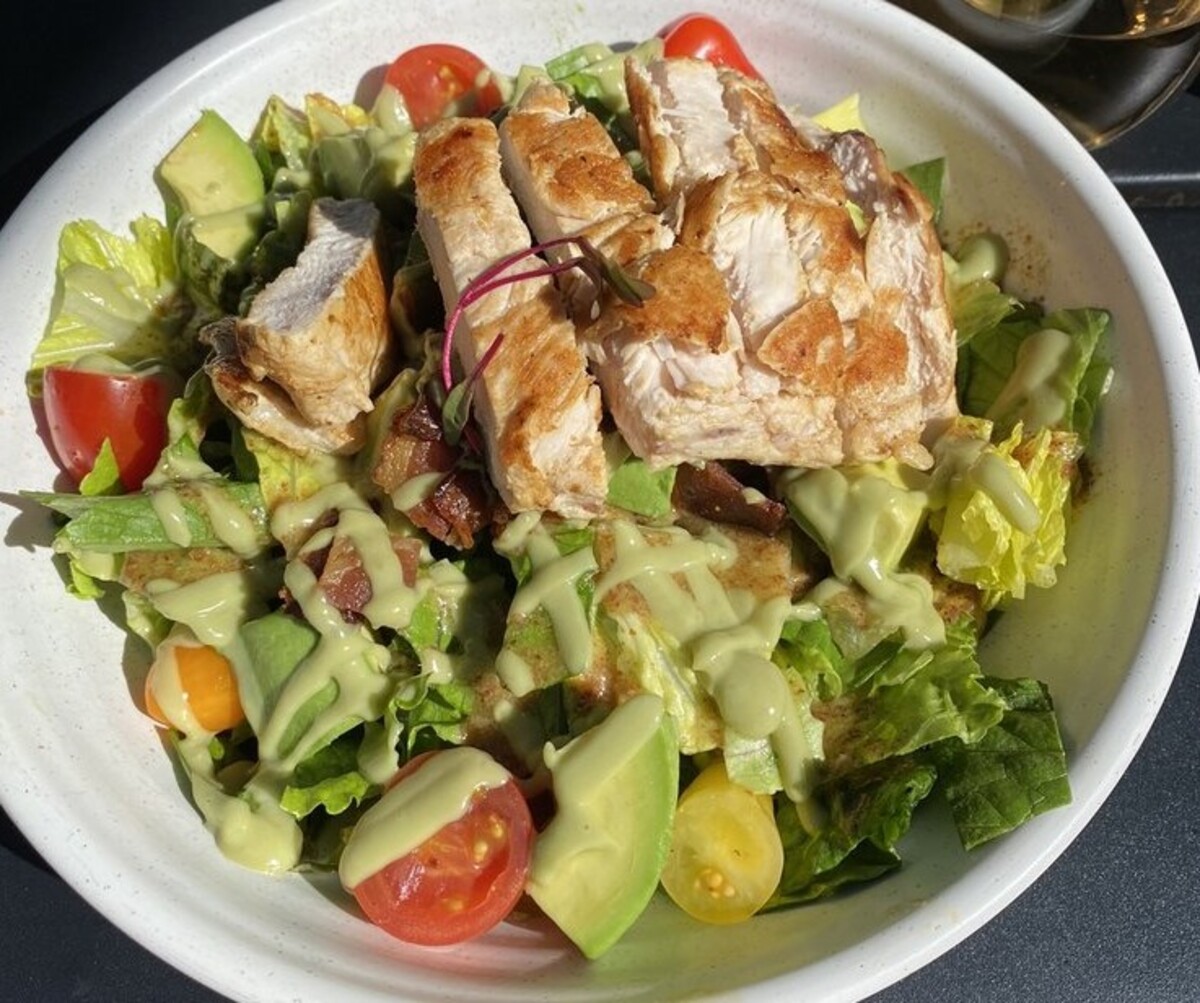 Avocado BLT Salad with chicken at Good Kitchen + Market located in Marietta, GA.