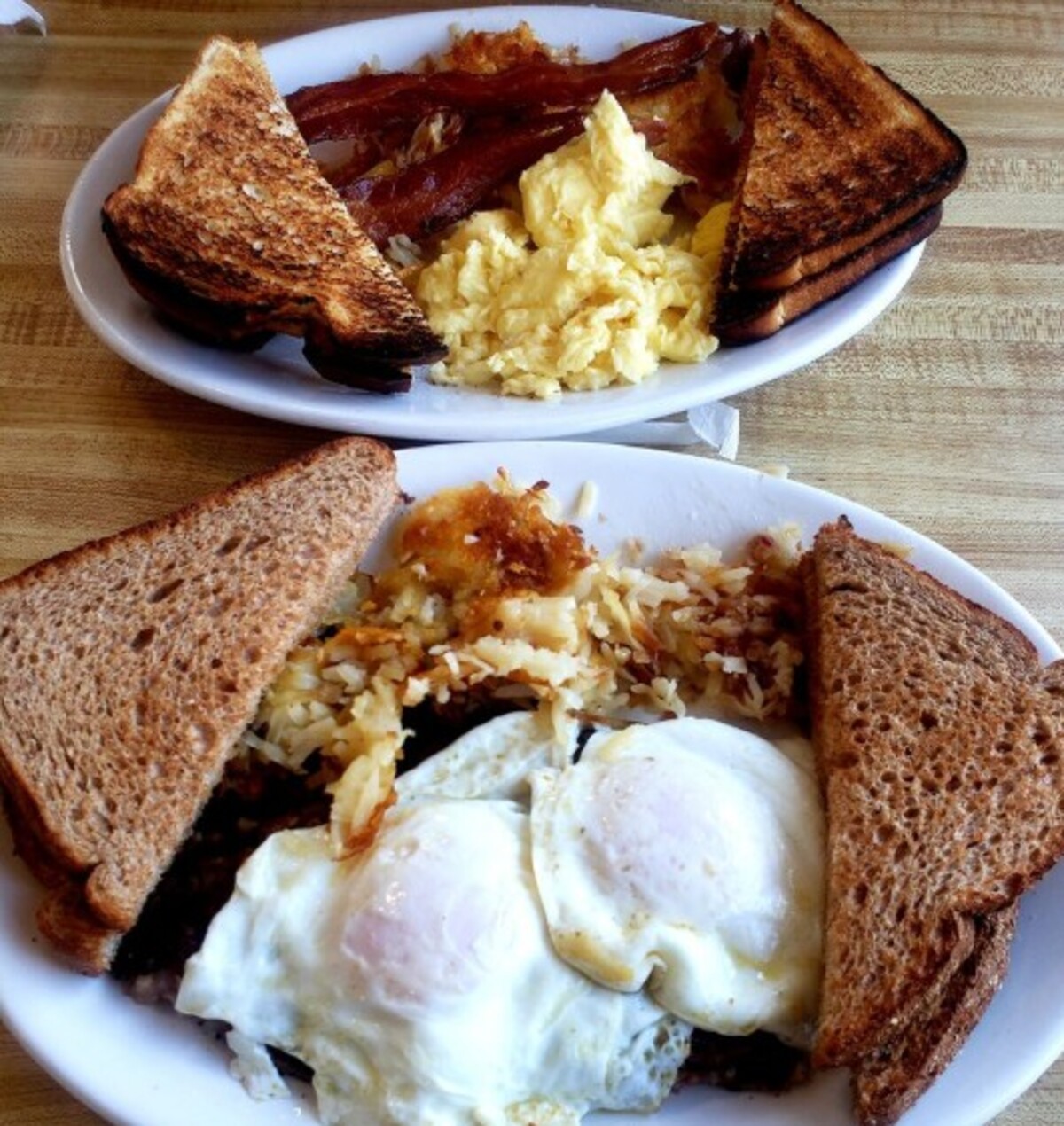 Breakfast combo with eggs over my corned beef hash at The Corner Cafe located in Lowell, MA. 