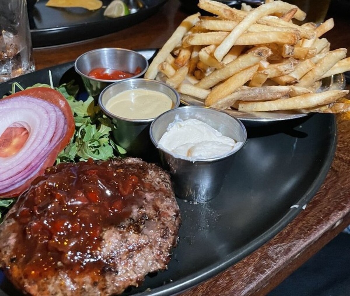 Burger and Fries at Tap 42 located in Boca Raton, FL. 