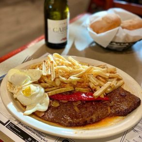 Caravela steak plate with eggs and fries at Caravela Family Restaurant located in Fall River, MA.