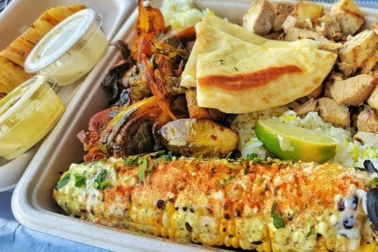 Chicken and street corn at Local Expedition Wood Fired Grill located in Alpharetta, GA.