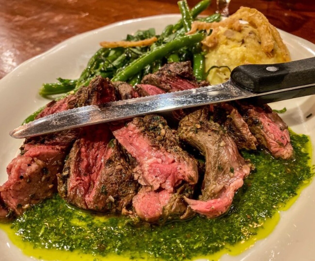 Chimichurri Hanger Steak at Tupelo Honey Southern Kitchen & Bar located in Asheville, NC.