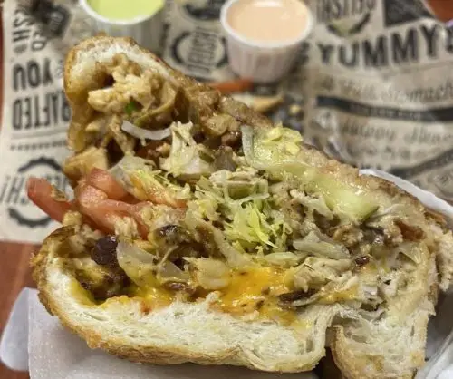 Chopped cheese sub ground beef for chicken at Lil Papi’s International Deli located in Concord, NC.