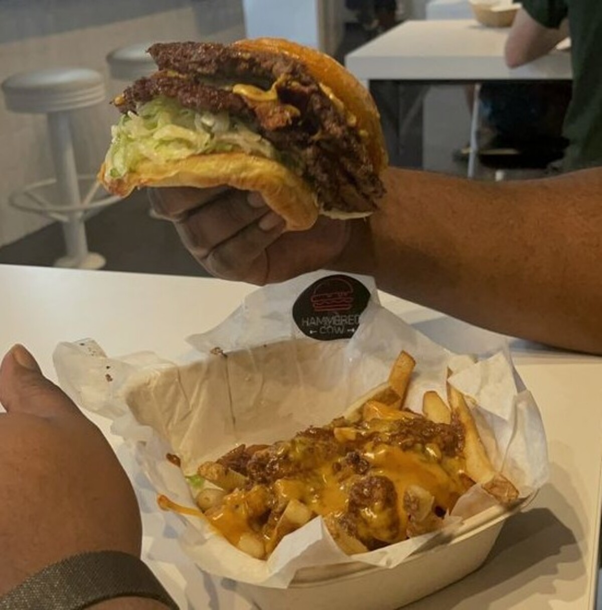 Double hamburger with chili cheese fries at Hammered Cow located in Mobile, AL. 