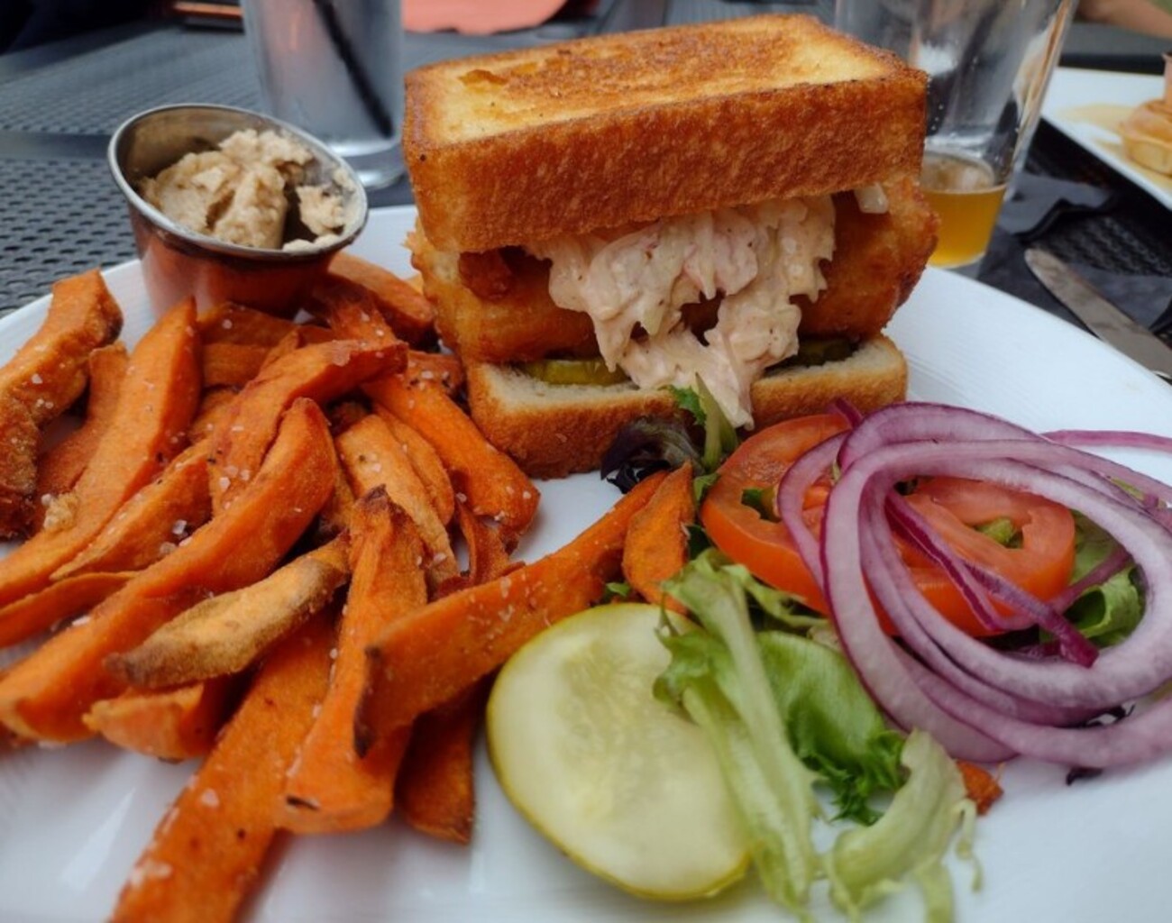 Fish sammich and sweet potato fries at Crave located in Akron, OH. 