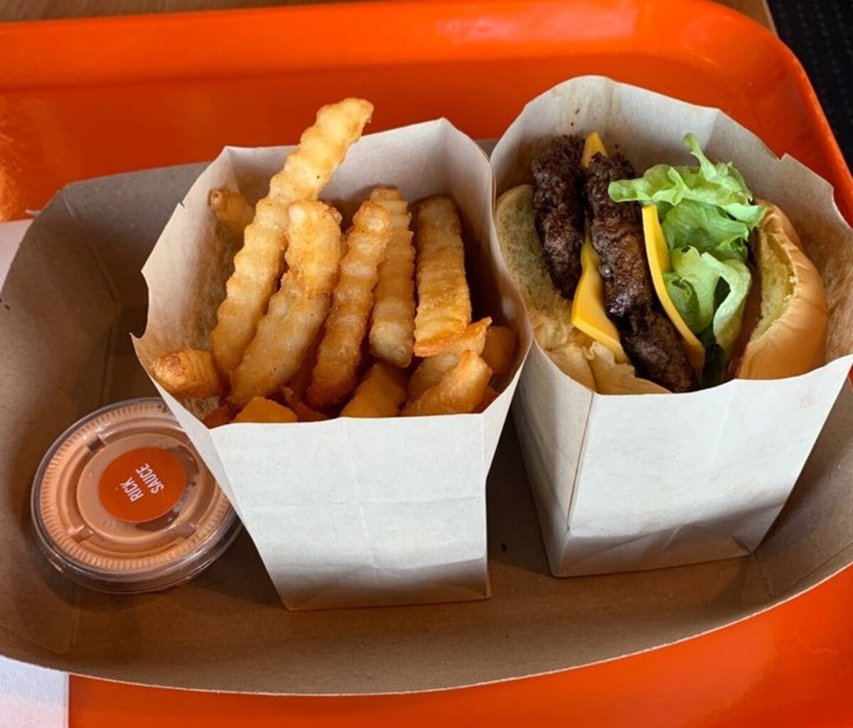 Double cheeseburger and fries with Rick sauce at Rick’s Famous located in Utica, NY. 