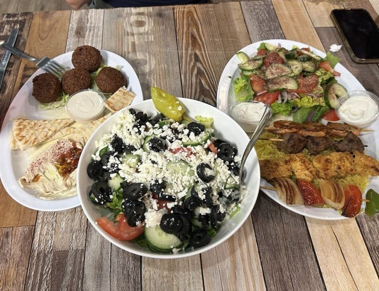 Falafel Appetizer, Greek Salad, Sampler Platter at Mediterranean Breeze Bar & Grill located in Gainesville, GA. 