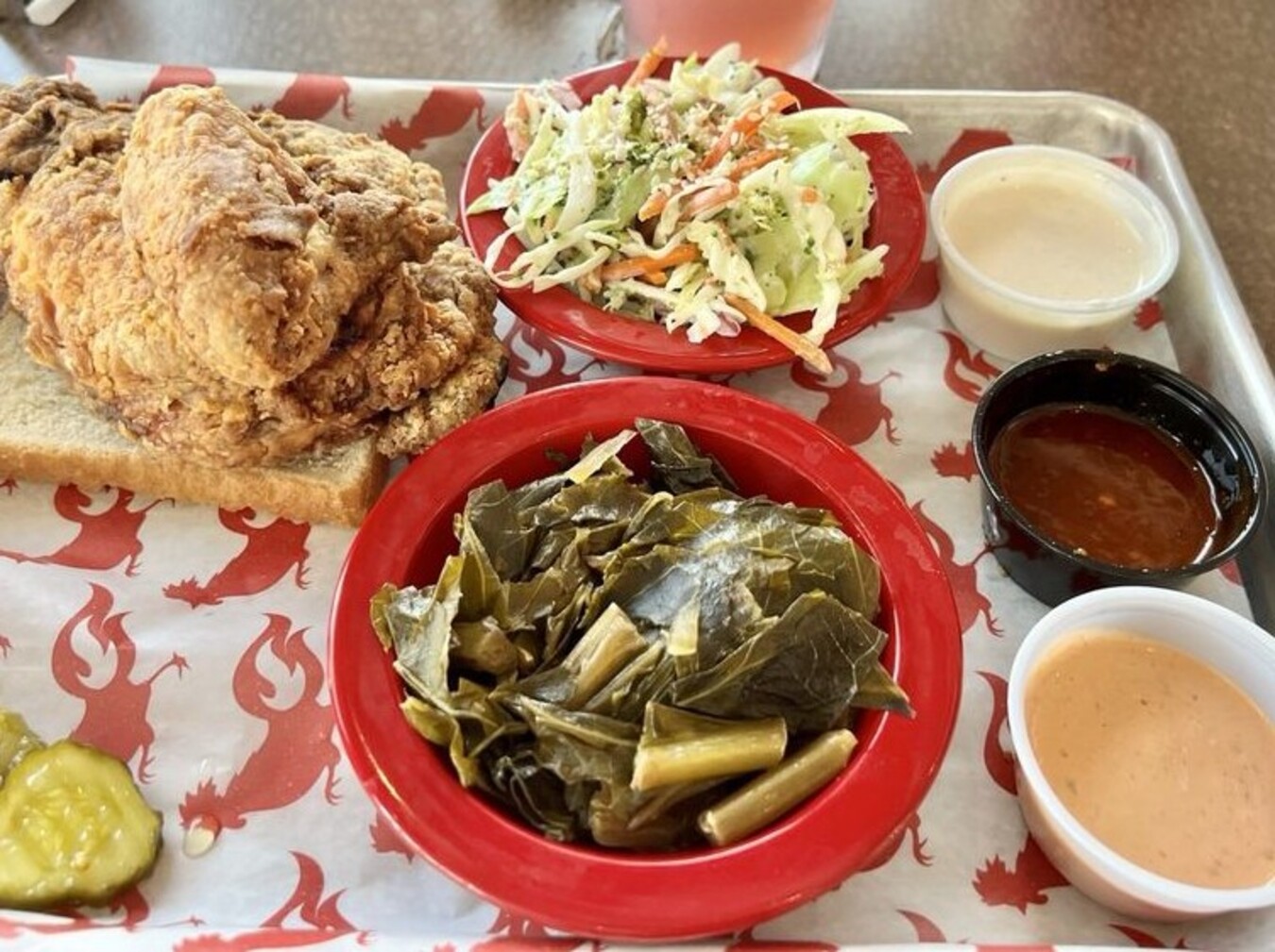 Fried Chicken, Slaw, and Greens at Flock Shop located in Spartanburg, SC. 