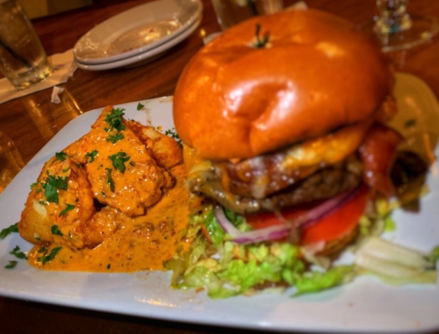 Fried Grit Cake and Harry's Burger at Harry's Seafood Bar and Grille located in Lakeland, FL.
