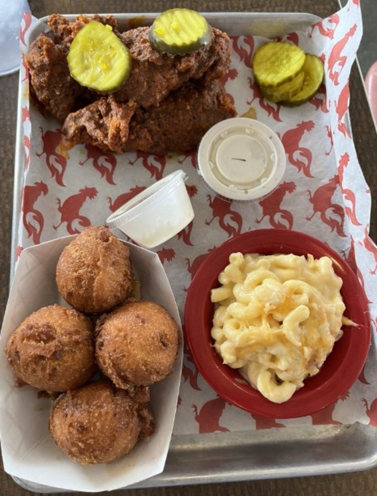Fried tenders, hot as they come, Mac & cheese and hush puppies at Flock Shop located in Spartanburg, SC. 
