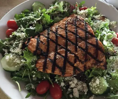 Marinated Salmon Salad with goat cheese, aged balsamic and argula at Harry's Seafood Bar and Grille located in Lakeland, FL.