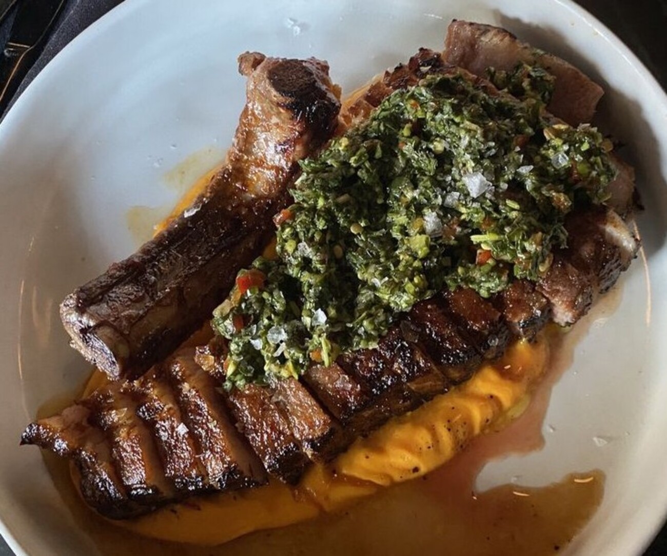 Pork chop & a paper plane at The Campground located in Kansas City, MO.