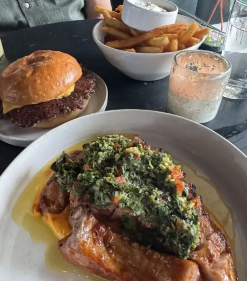 Pork chop, french fries, and burger at The Campground located in Kansas City, MO.