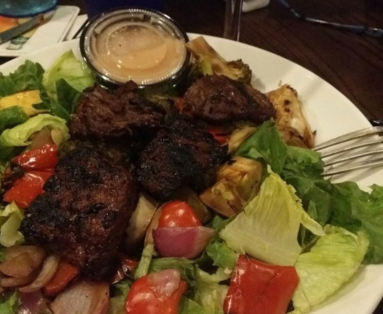 Roasted veggie salad with steak tips at Brack’s Grille & Tap located in Brockton, MA. 