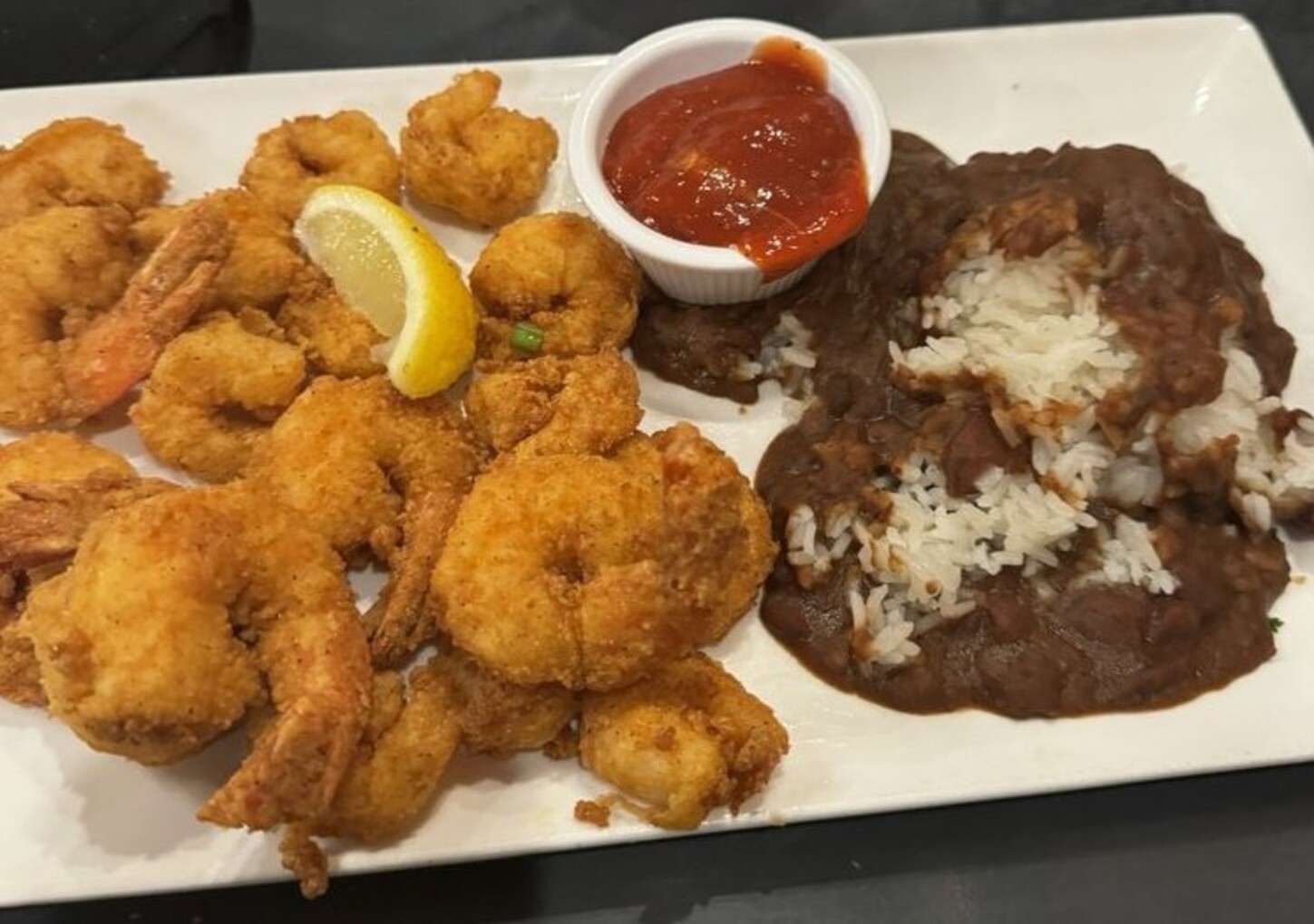 Shrimp platter with extra shrimp with red beans and rice at Harry's Seafood Bar and Grille located in Lakeland, FL.