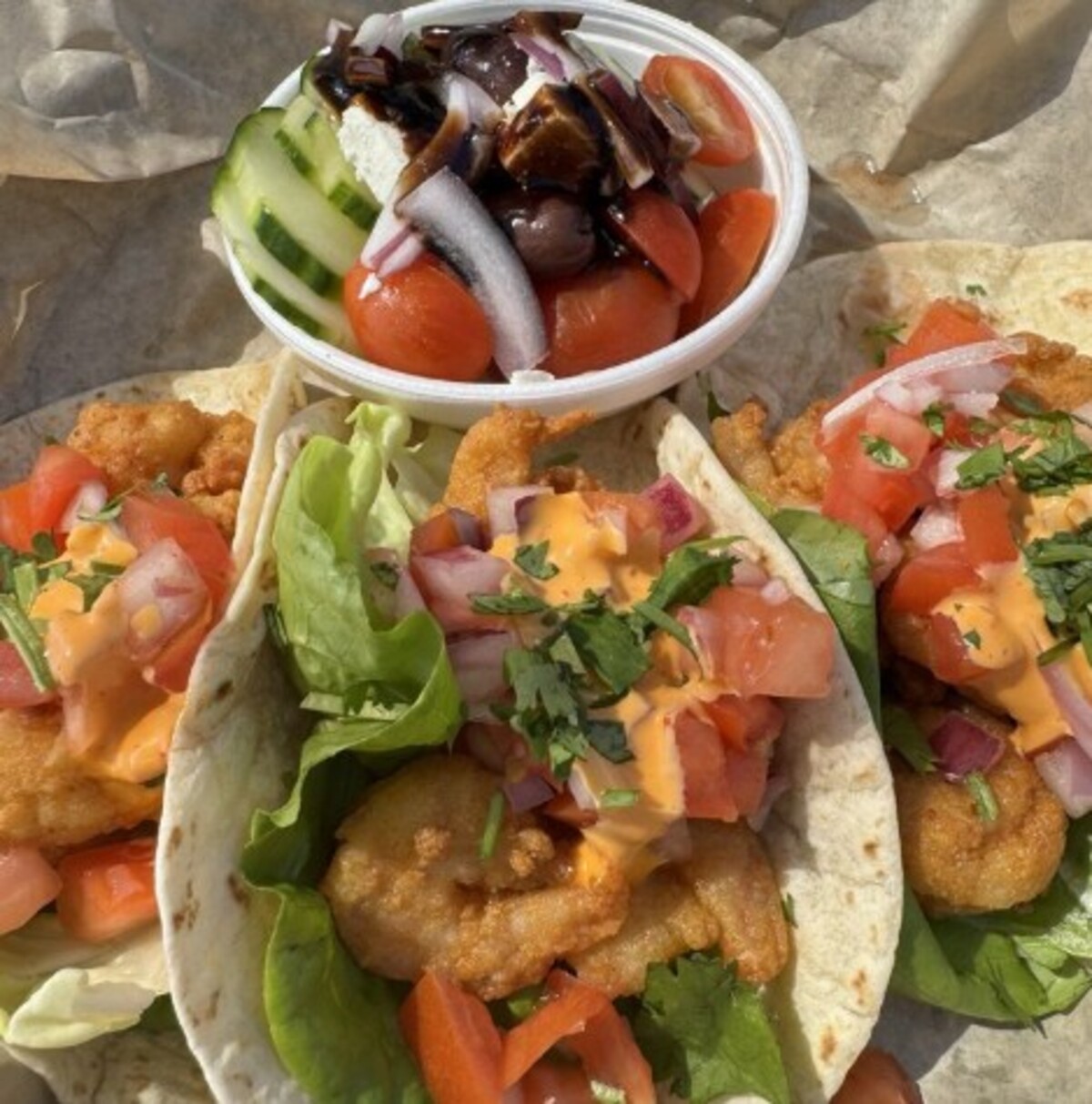 Shrimp tacos with cucumber salad at Emma's Southern Kitchen located in Knoxville, TN. 