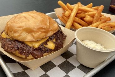 Smash burger and fries at The Campground located in Kansas City, MO.
