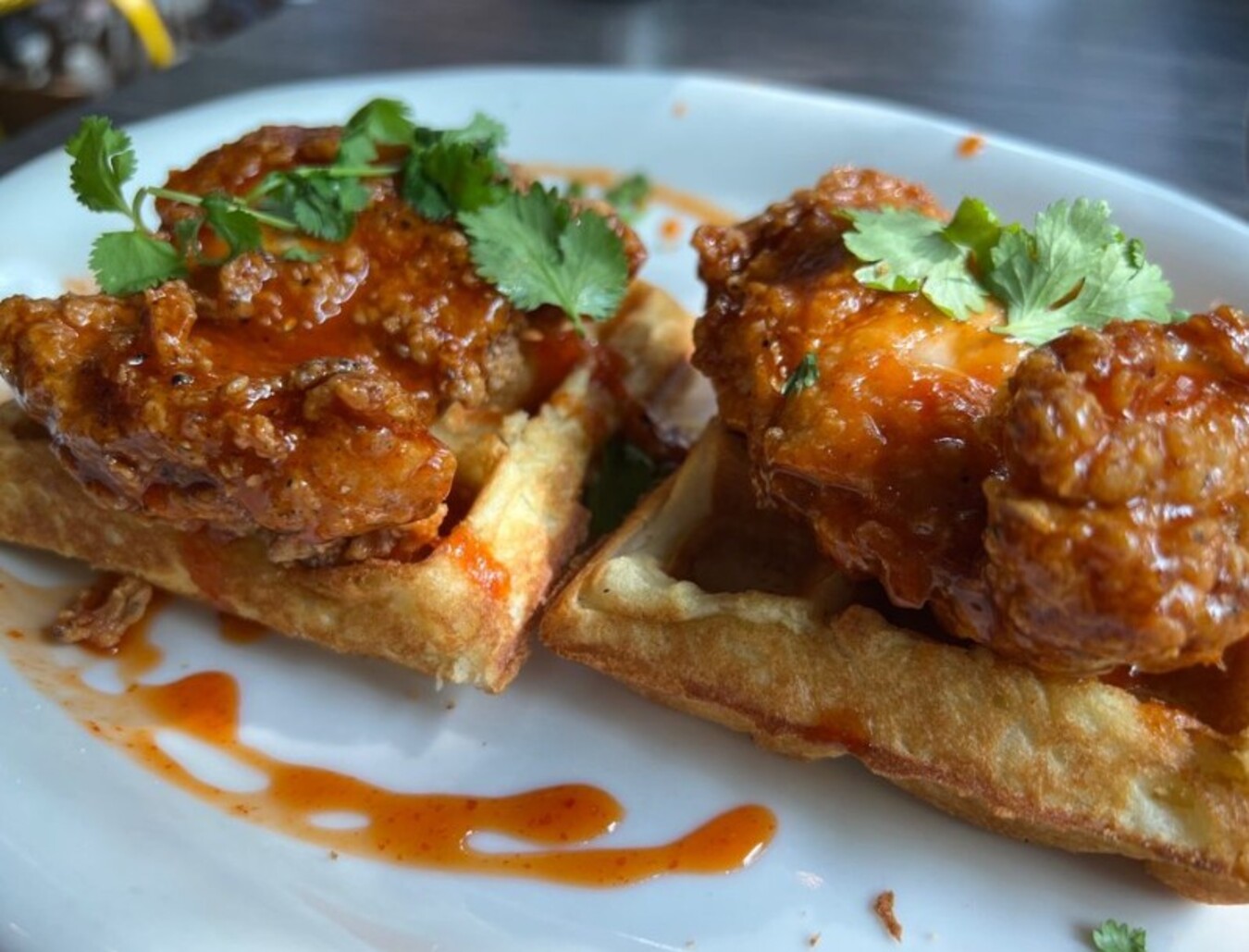 Sriracha honey fried chicken and waffles at Tupelo Honey Southern Kitchen & Bar located in Asheville, NC.