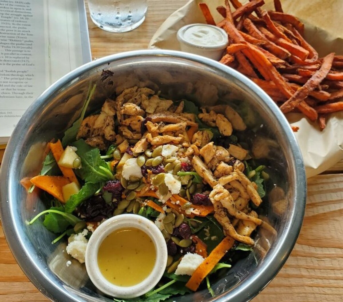 The Eve salad and epic sweet potato fries at Revival Eastside Eatery located in Waco, TX. 
