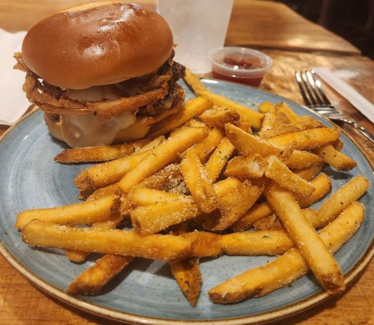 The Southern Smash burger with the bar fries at Tap and Pour located in Warner Robins, GA. 