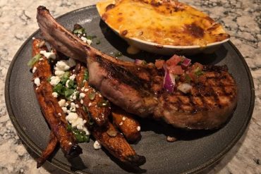 Tomahawk Pork Chop at Firebirds Wood Fired Grill located in Murfreesboro, TN.
