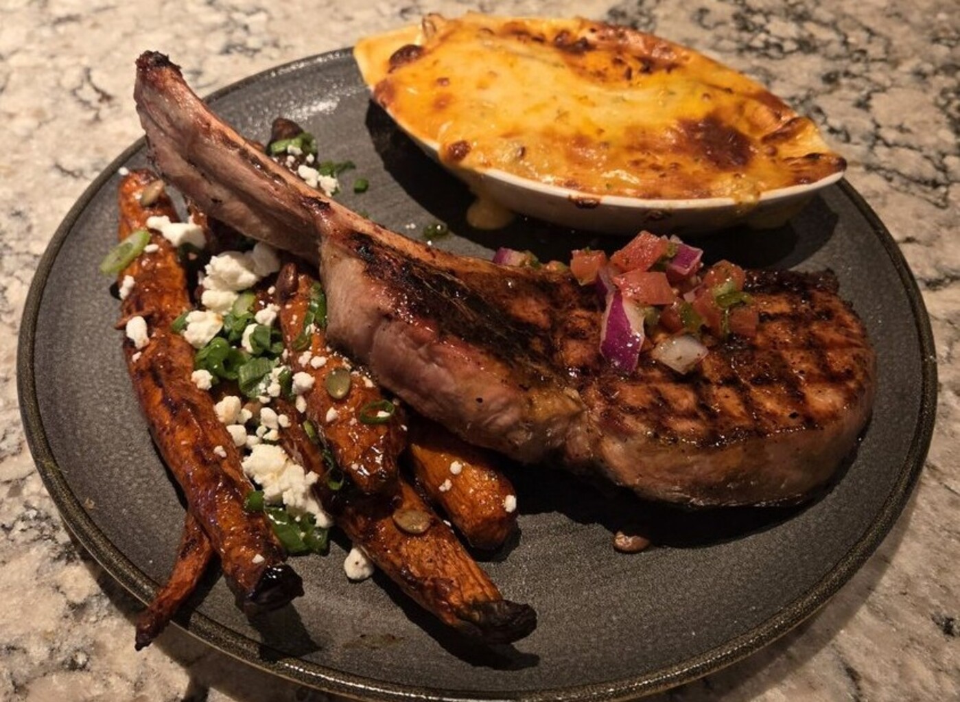 Tomahawk Pork Chop at Firebirds Wood Fired Grill located in Murfreesboro, TN. 