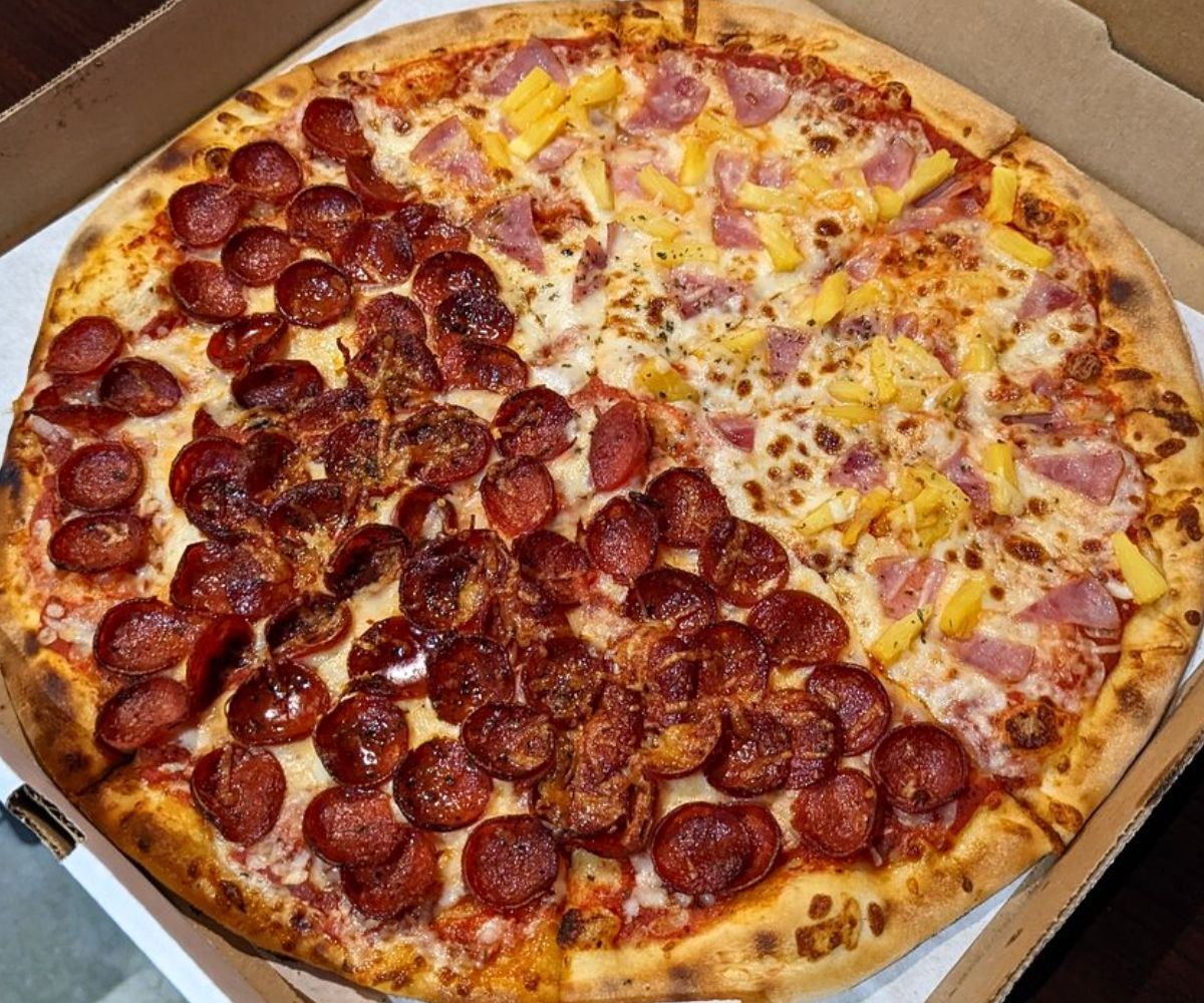 Half-pepperoni, half-hawaiian pizza at Smoking Monkey Pizza in Renton, Washington