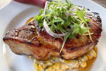 Sweet Tea Brined Pork Chop at 440 Main in Bowling Green, Louisiana