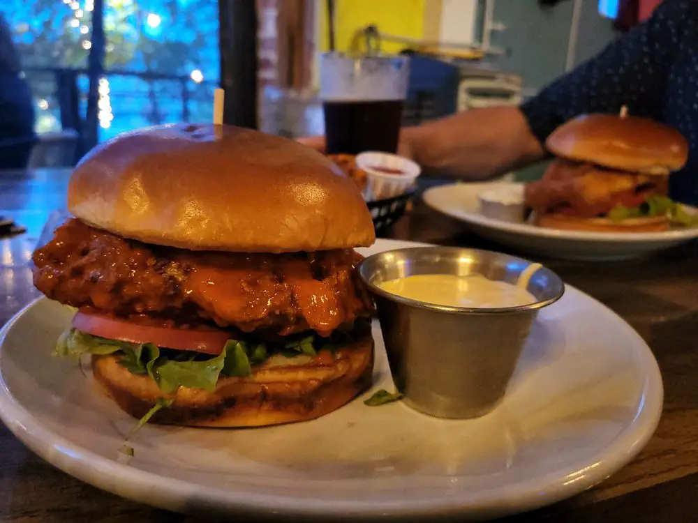 Fried Chicken Sandwich minus the mayo, tossed in buffalo with a side of honey mustard