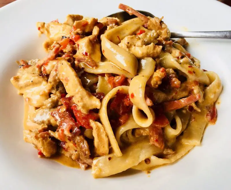 Chicken, sausage, soppressata, sweet roasted red peppers, in a spicy Alfredo sauce, fettuccine