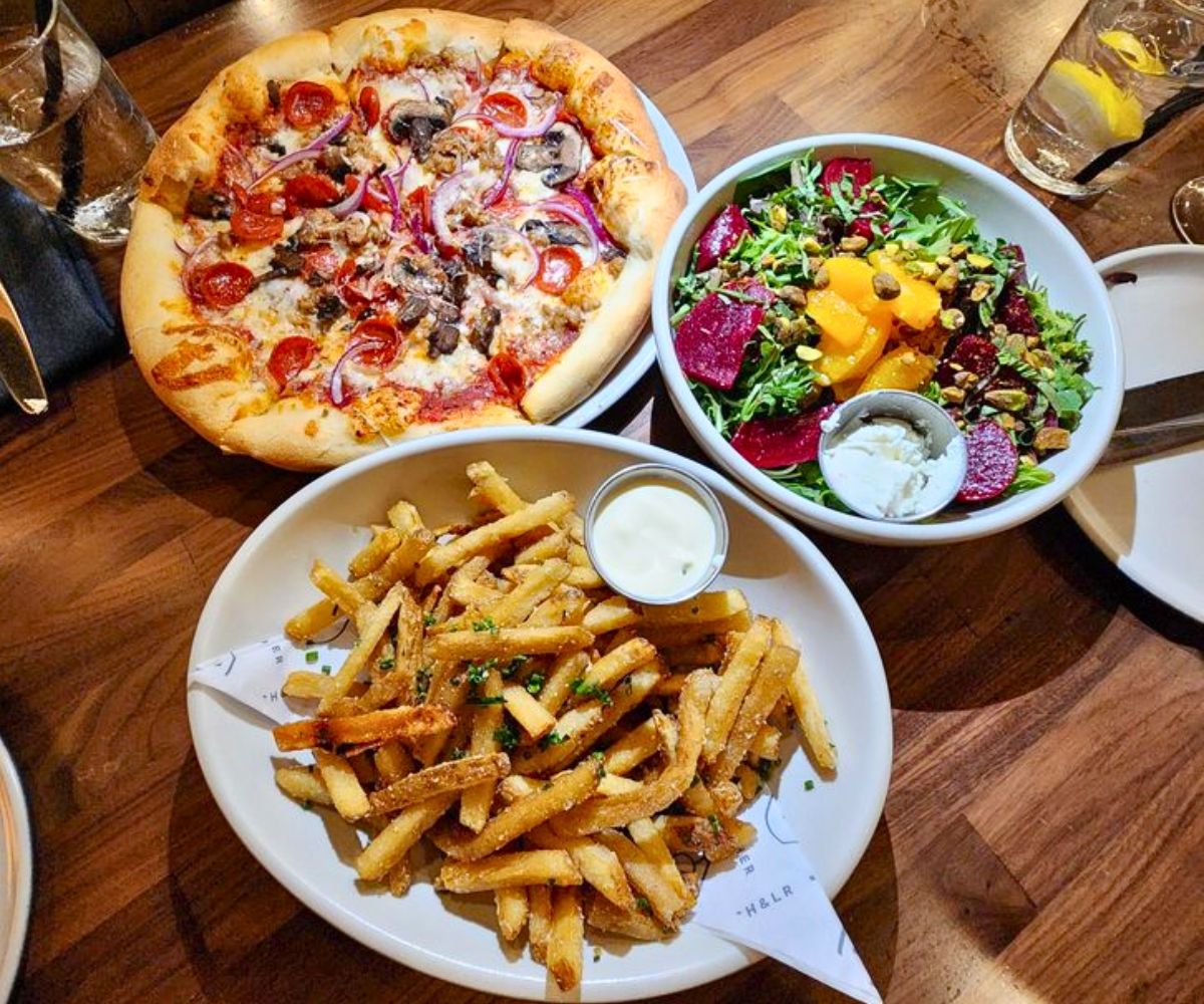Beet salad, truffle fries, and mushroom and pepperoni pizza at George & Gather in Chandler, Arizona